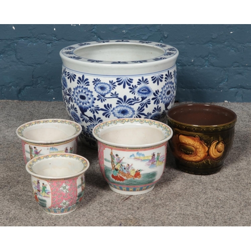 321 - A large blue and white ceramic planter, together with a trio of smaller Chinese and West German exam... 