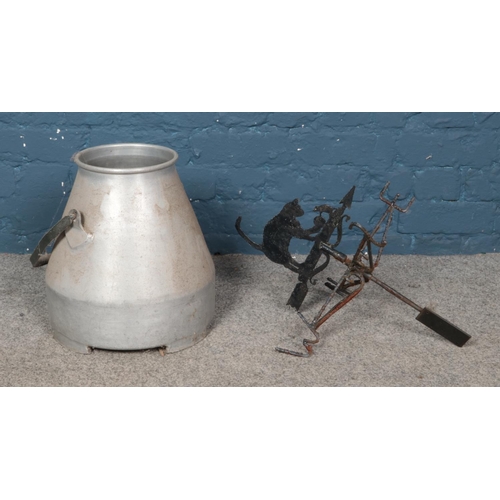 339 - Metal milk churn along with cast iron weathervane with cat on top.