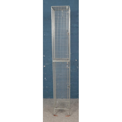 340 - A tall wire locker. Approx. dimensions 198cm x 30cm x 31cm.