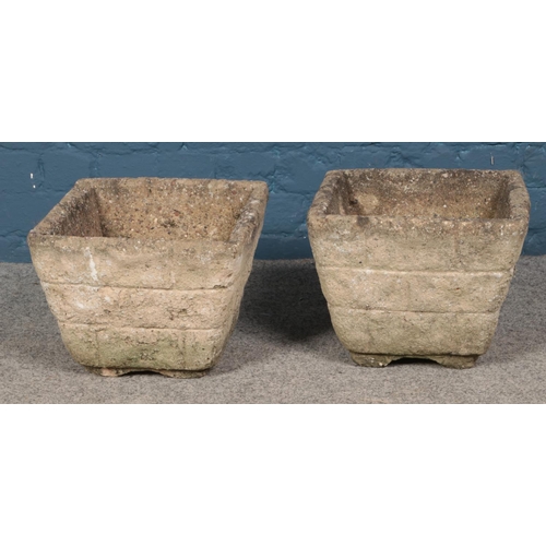 341 - A pair of concrete planters. Approx. dimensions 34cm x 34cm x 26cm.