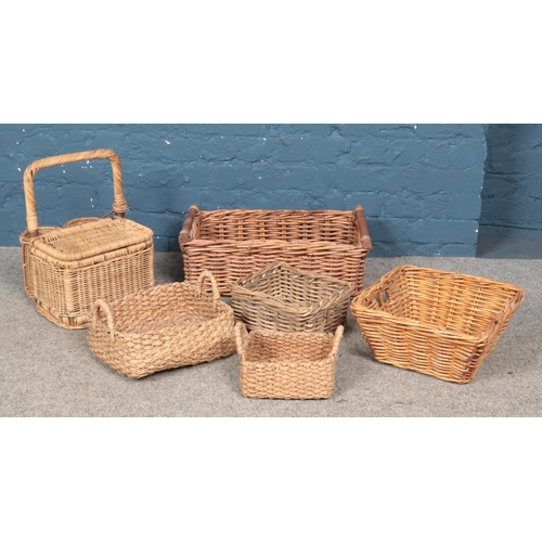 354 - A collection of wicker baskets, including partially lidded example.