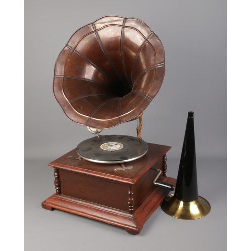 358 - An unmarked reproduction gramophone along with extra brass horn.