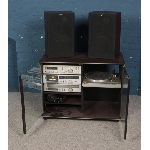 374 - A Toshiba sound system in sliding front cabinet including SR-A25 turntable, Amplifier SB-A25, Casett... 