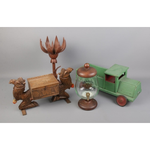 395 - A collection of mostly wooden collectables including handmade wooden truck, cognac dispenser and cam... 