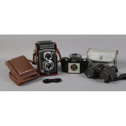 66 - A cased Hacoflex camera, with Anastigmat lens; together with a Kodak Brownie camera and a vintage pa... 