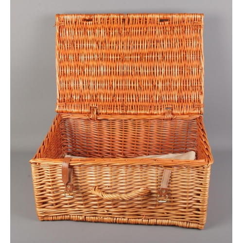 423 - A wicker picnic hamper basket marked F&M to top.