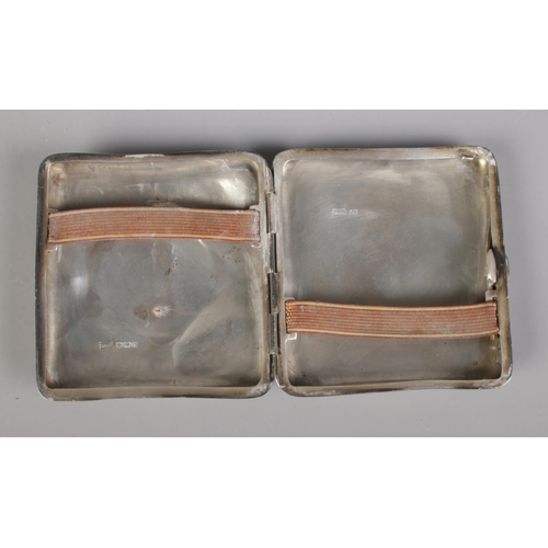 434 - A silver Walker and Hall cigarette case featuring monogram to front. Assayed Sheffield 1917, 100.8g.