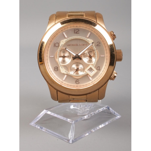 453 - A Michael Kors gold tone chronograph wristwatch, with stainless steel bracelet.