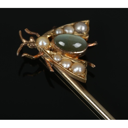 459 - A Chrysoprase and Pearl set insect stick pin. Pin tests as 9ct Gold, with the mount as high carat. T... 