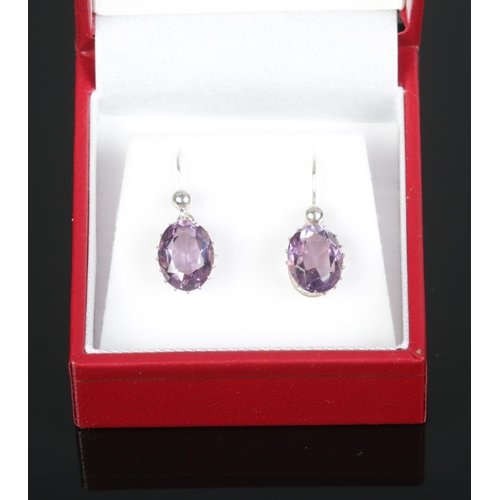 465 - A cased pair of silver amethyst drop earrings.