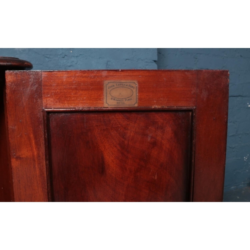 507 - A Victorian mahogany shelved bedroom cabinet, bearing label for 'John Easten and Sons, Hull'.