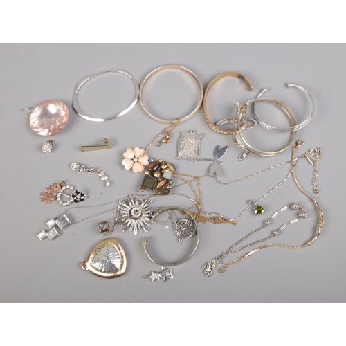 98 - A collection of costume jewellery bracelets, bangles and pendants including floral and sunburst exam... 