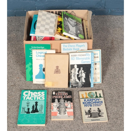 604 - A collection of chess books.