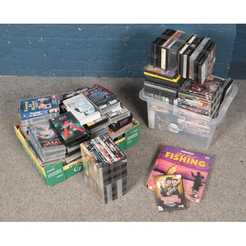 212 - A large collection of DVD's and VHS including The Lord of the Rings, Titanic, Gladiator, etc.