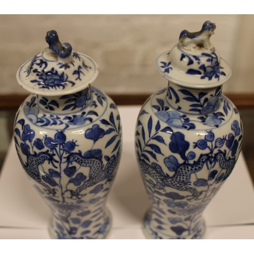 7 - A collection of blue and white ceramics to include tulip vase and pair of baluster lidded vase beari... 