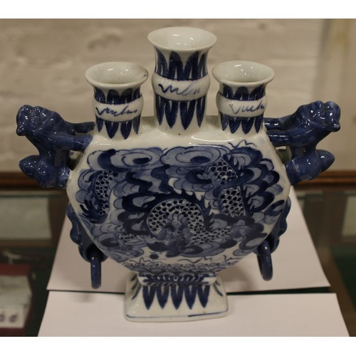 7 - A collection of blue and white ceramics to include tulip vase and pair of baluster lidded vase beari... 