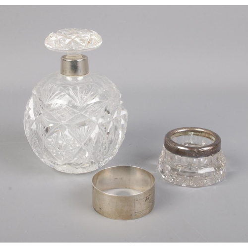 388 - Two silver rimmed cut glass vanity items along with continental silver napkin ring. Hallmarks variou... 