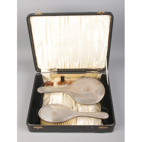 391 - A silver Daniel Manufacturing Company cased vanity set including mirror, brush and comb. Hallmarked ... 