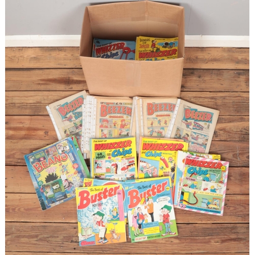 438 - A box of comics. Includes Whizzer & Chips, Beezer, Buster, etc.