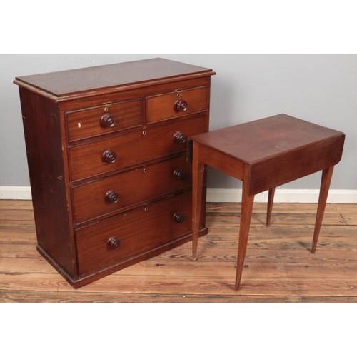 414A - A Victorian mahogany chest of two over three drawers along with a mahogany pembroke table.