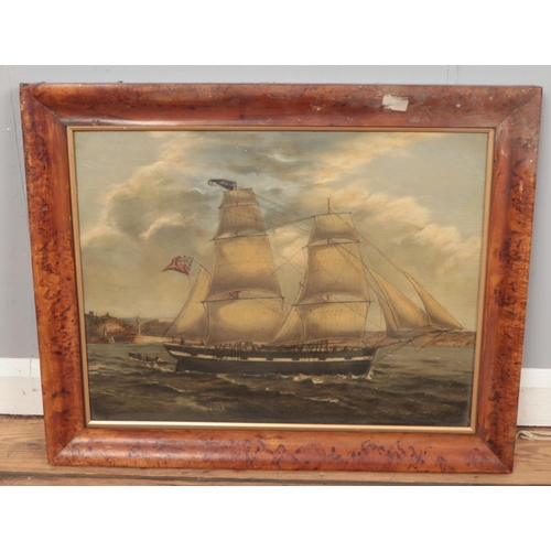 256 - A framed oil on board depicting a ship at sea. (41cm x 54cm)