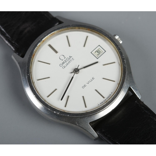 265 - An Omega De Ville quartz wristwatch, with baton markers and date window, on black leather strap.