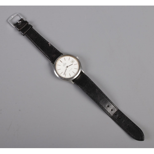 265 - An Omega De Ville quartz wristwatch, with baton markers and date window, on black leather strap.