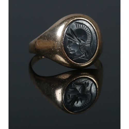 285 - A 9ct Gold Hematite Intaglio signet ring. Inscription on the inside of the band '14/9/63 Myra-Charle... 