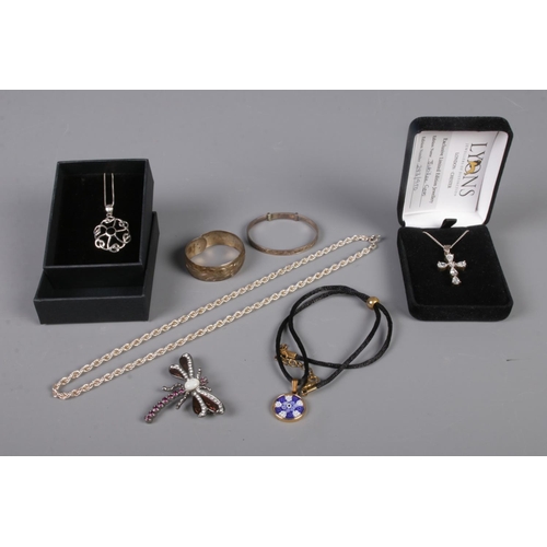 295 - A quantity of jewellery, mainly silver. To include 'Jubilee Cross' on chain, christening bangles and... 