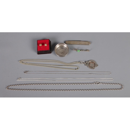 297 - A collection of silver including fob, chains, pocket knife, etc. along with pair of 9ct earrings. (0... 