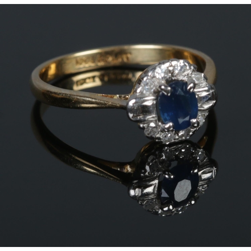 299 - An art deco 18ct Gold and Platinum Sapphire and Diamond cluster ring. Size L½. Total weight: 2.8g.