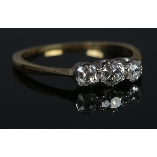 303 - An 18ct Gold and three stone old cut diamond ring, with the largest stone just under ¼ct. Size O. To... 