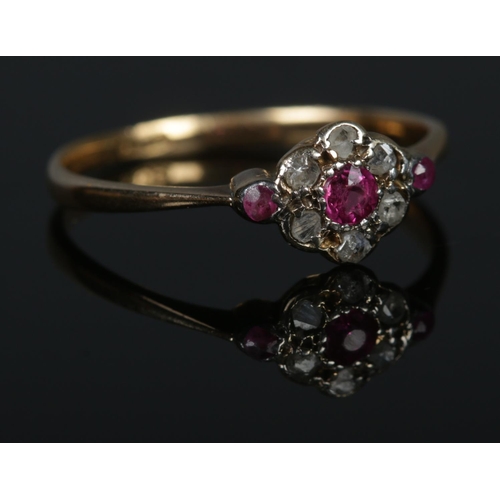 306 - An 18ct Gold Ruby and Diamond cluster ring. Size O. Total weight: 1.7g.