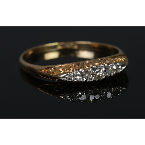 308 - An 18ct Gold and five stone diamond ring. Size P½. Total weight: 2.3g