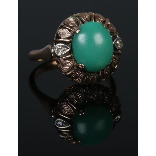 310 - A 9ct Gold, Turquoise and Diamond dress ring. Size L½. Total weight: 5.1g