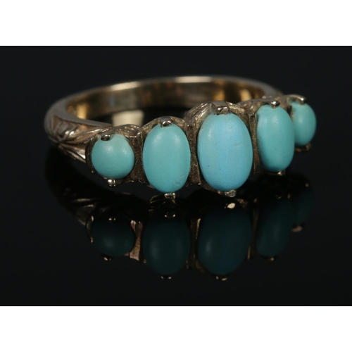 311 - A 9ct Gold and five stone turquoise ring. Size O. Total weight: 4.3g.