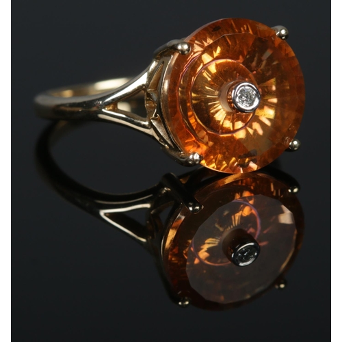 312 - A 10ct Gold Citrine and Diamond taurus ring, by Lehrer. Size N½. Total weight: 3.0g