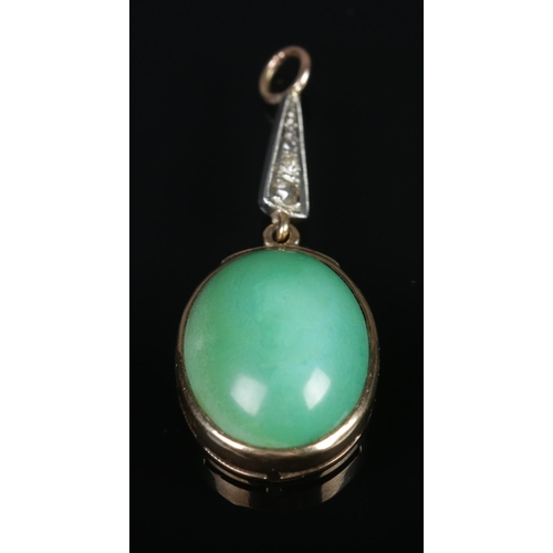 320 - A green stone and diamond pendant in 9ct gold mount.