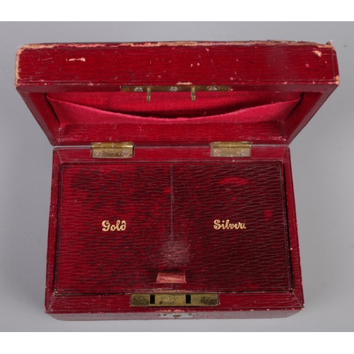 333 - A maroon jewellery box, with interior for 'Gold/Silver', containing oddments of .925 silver; includi... 