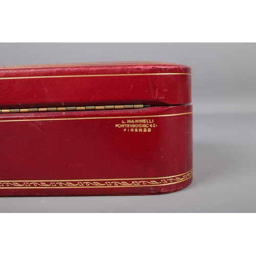 335 - An L. Mannelli red leather jewellery box containing fourteen vintage and Victorian silver brooches, ... 