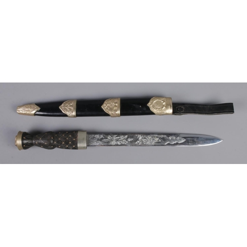 361 - A replica Scottish Dirk dagger featuring engraved thistle decoration to blade and white metal crown ... 