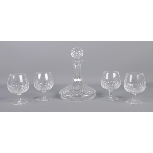 365 - A Waterford crystal ships decanter, together with four Waterford crystal brandy glasses.