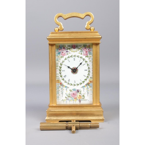 370 - A miniature brass and painted floral enamel carriage clock, by Deacon, Swindon. With key. Height (in... 