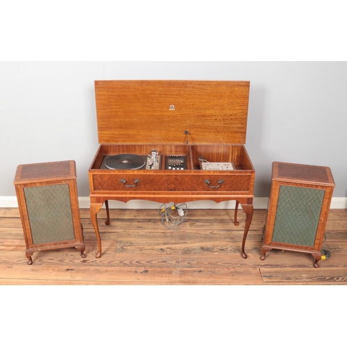 404 - A Dynatron (Hambledon HFC 62) radiogram with Goldring turntable in mahogany case with two matching s... 