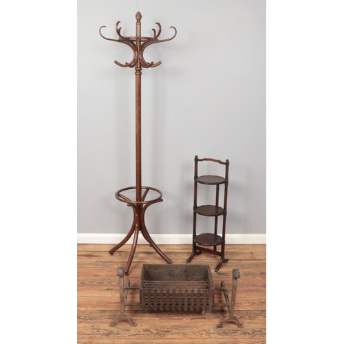 405 - Floor standing coat rack with three tier cake stand and wrought iron fire grate with dogs.