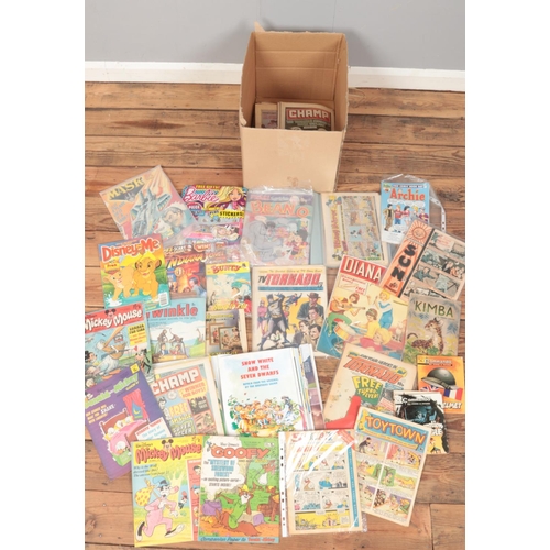 428 - A box of comics. Includes 1970s Walt Disney Mickey Mouse, Commando, Tornado, Champ, etc.