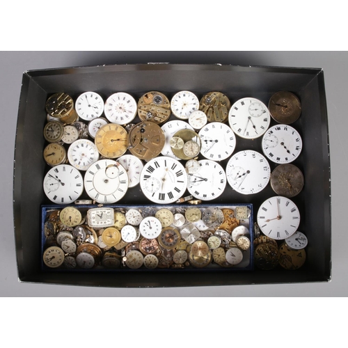 100 - A box of pocket watch and wristwatch faces and movements, to include examples from Omega, Tudor and ... 