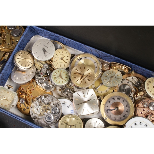 100 - A box of pocket watch and wristwatch faces and movements, to include examples from Omega, Tudor and ... 