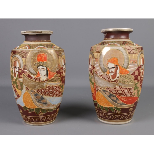 110 - A large pair of Japanese satsuma vases sharing immortals and goddess decoration. 


Height 32cm