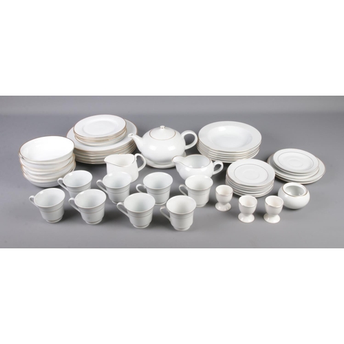 126 - A mixed tea set of white and gold rim mostly Tienshan, Rayware and Bohemia